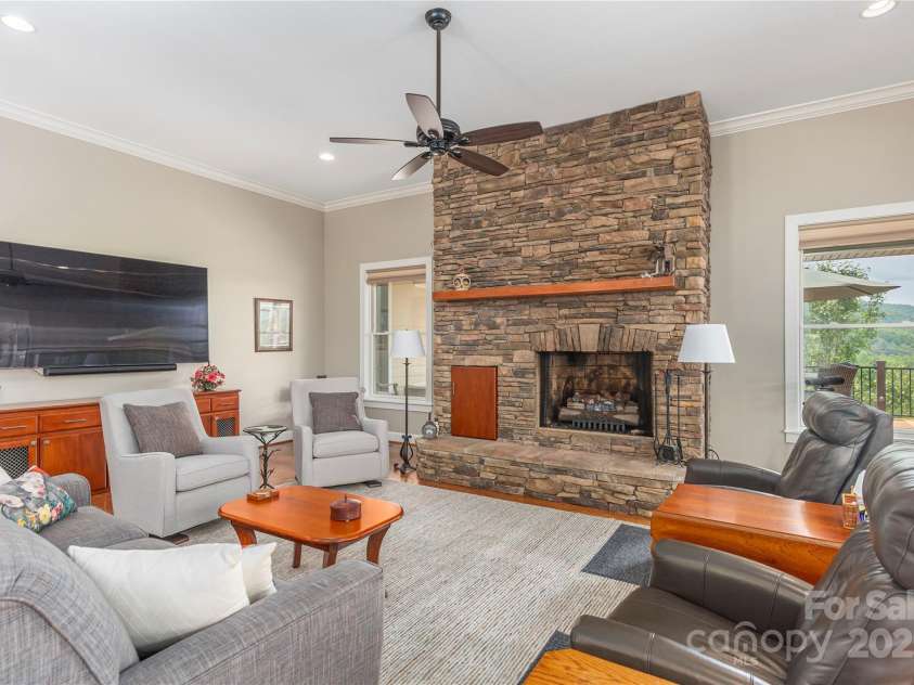 930 Big Raven Lane, Saluda, NC 28773.  MLS# CAR4270163, YatesRealty ID 21407. Vaulted ceilings provide a luxurious experience in the living room and beyond