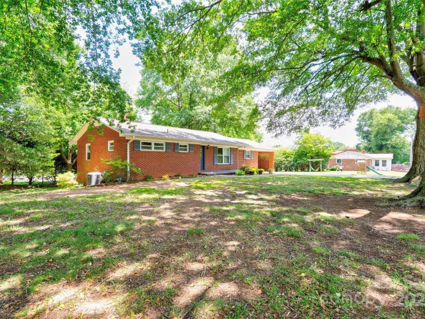 619 Sanders Road, Shelby, NC 28150.  MLS# CAR4256179, YatesRealty ID 21409. Front & Left Side