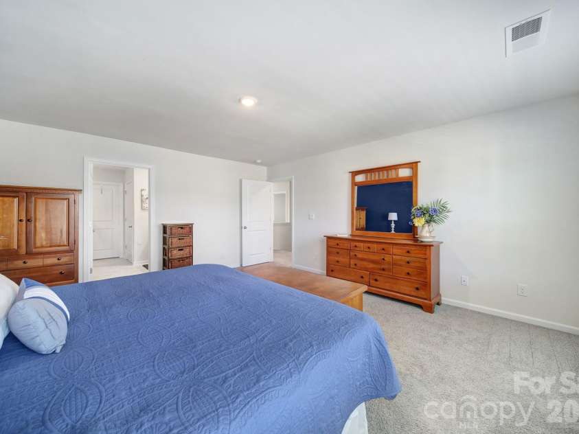 107 Spring Hall Drive, Troutman, NC 28166.  MLS# CAR4363335, YatesRealty ID 21416. Primary Bedroom