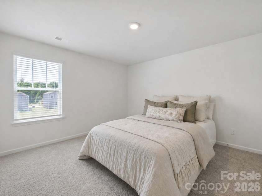 107 Spring Hall Drive, Troutman, NC 28166.  MLS# CAR4363335, YatesRealty ID 21416. Secondary Bedroom