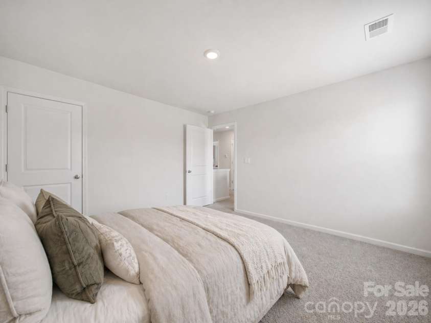 107 Spring Hall Drive, Troutman, NC 28166.  MLS# CAR4363335, YatesRealty ID 21416. Secondary Bedroom