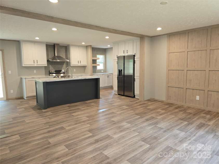 28 McGee Hill Road, Fairview, NC 28730.  MLS# CAR4234757, YatesRealty ID 21416. Livingroom opens into kitchen and dining.