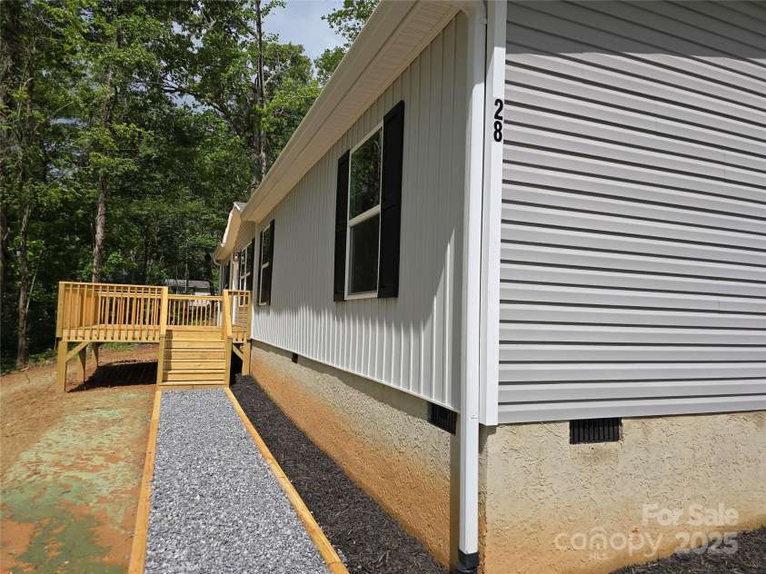 28 McGee Hill Road, Fairview, NC 28730.  MLS# CAR4234757, YatesRealty ID 21416. Walkway into front door.