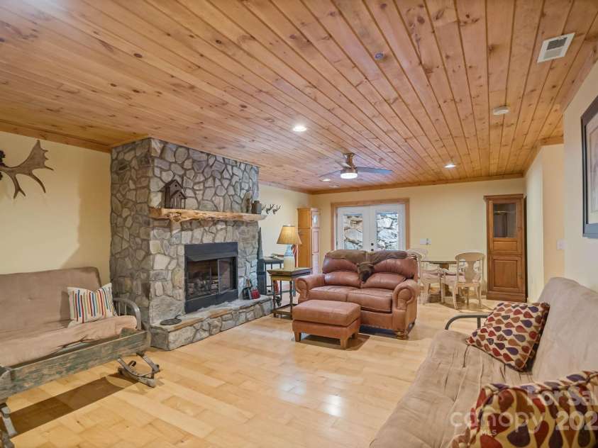140 Spruce Hollow Road, Beech Mountain, NC 28604.  MLS# CAR4263469, YatesRealty ID 21427. Lower Level Family Room Opens to Patio