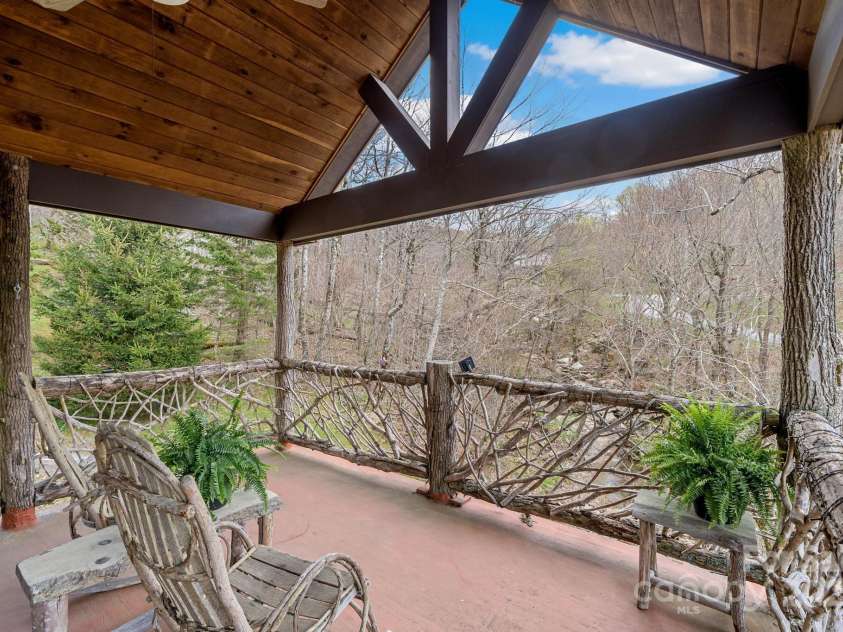 140 Spruce Hollow Road, Beech Mountain, NC 28604.  MLS# CAR4263469, YatesRealty ID 21427. Upper Level Porch OverLooking Creek
