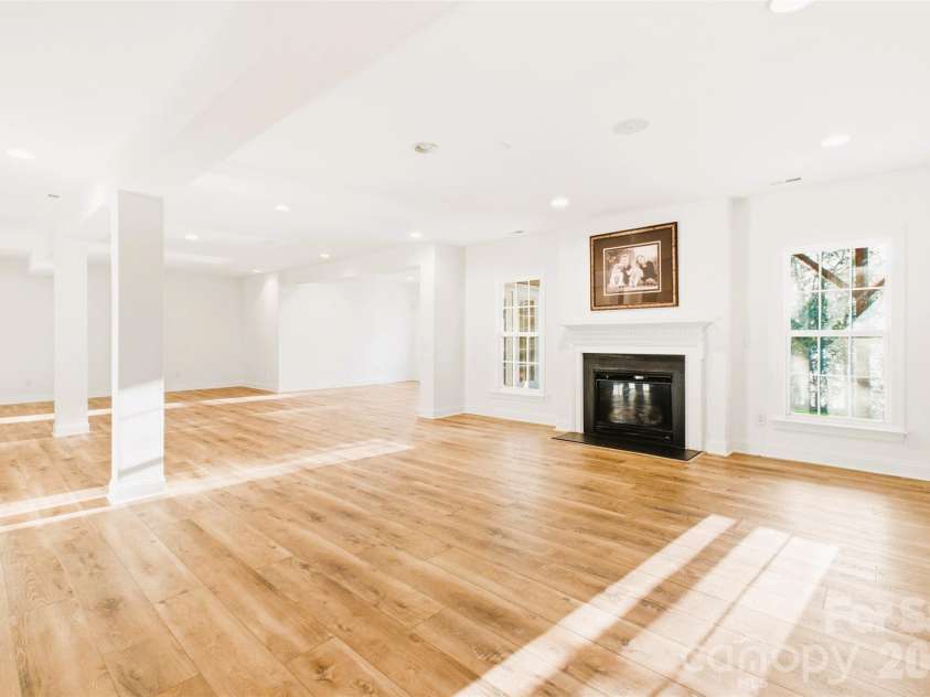 220 Woodwinds Drive, Mount Holly, NC 28120.  MLS# CAR4361261, YatesRealty ID 21427. Basement with a fireplace