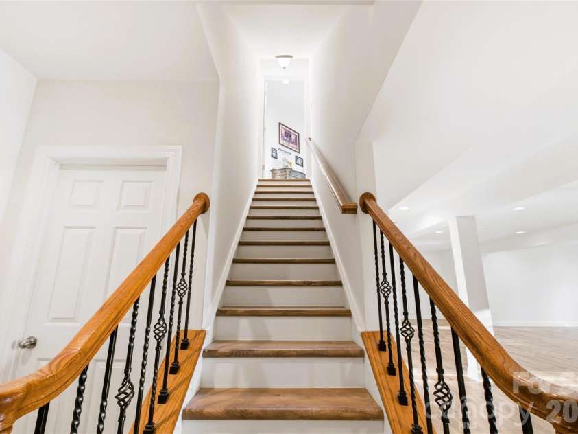 220 Woodwinds Drive, Mount Holly, NC 28120.  MLS# CAR4361261, YatesRealty ID 21427. Beautiful basement