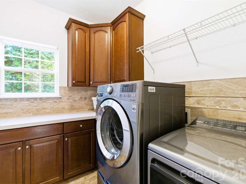 220 Woodwinds Drive, Mount Holly, NC 28120.  MLS# CAR4361261, YatesRealty ID 21427. Main floor Laundry Room