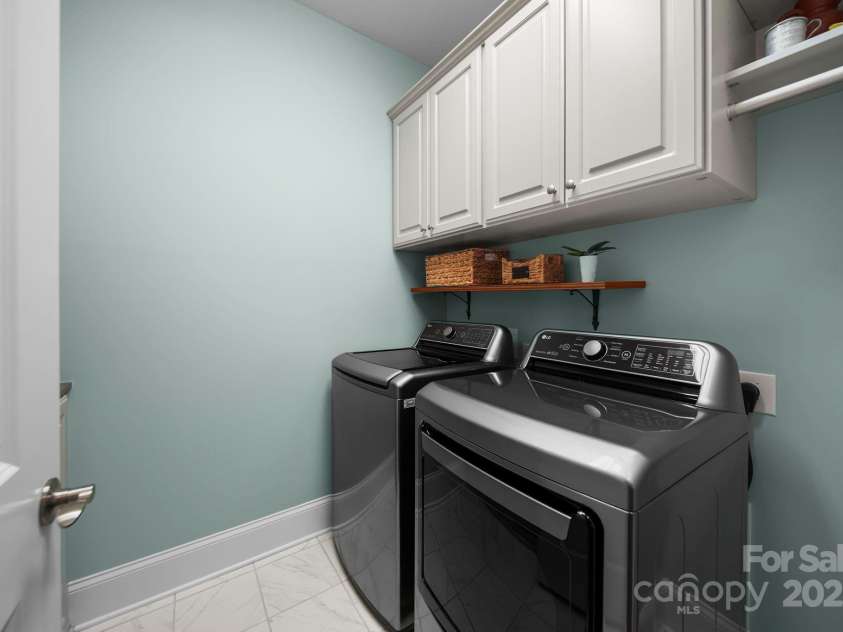5256 Courtyard Lane, Belmont, NC 28012.  MLS# CAR4299282, YatesRealty ID 2143. Laundry room with cabinetry