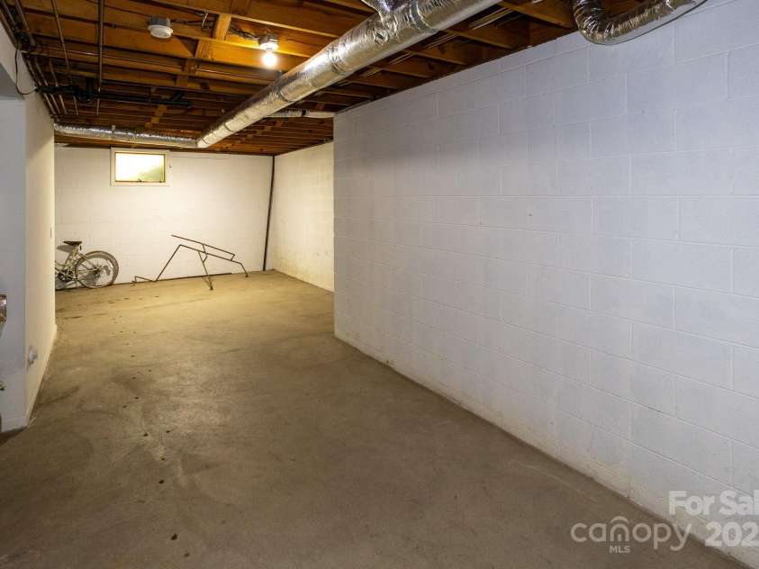 15 Cedar Trail, Asheville, NC 28803.  MLS# CAR4270530, YatesRealty ID 21431. Basement with tons of storage