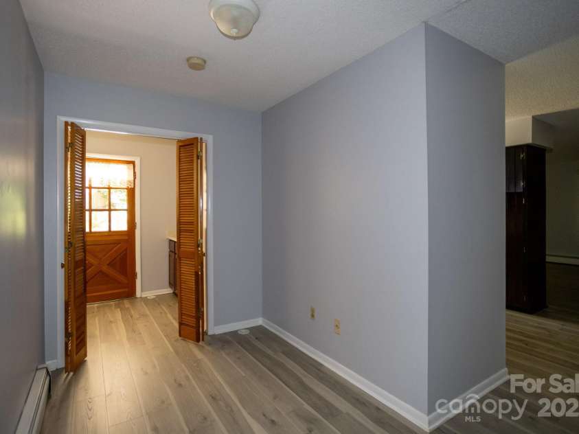 15 Cedar Trail, Asheville, NC 28803.  MLS# CAR4270530, YatesRealty ID 21431. Hallway to back door and laundry room