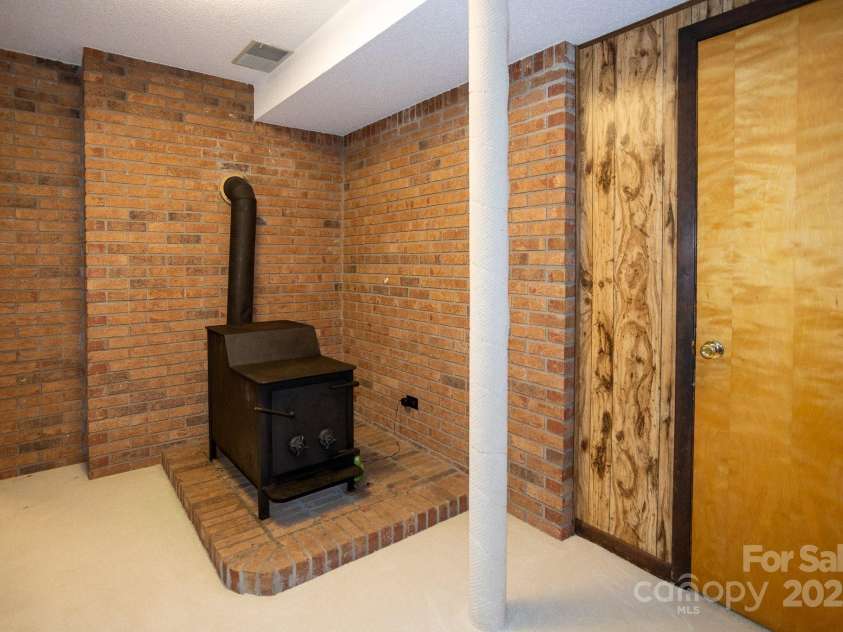 15 Cedar Trail, Asheville, NC 28803.  MLS# CAR4270530, YatesRealty ID 21431. Supplemental Wood Heat!