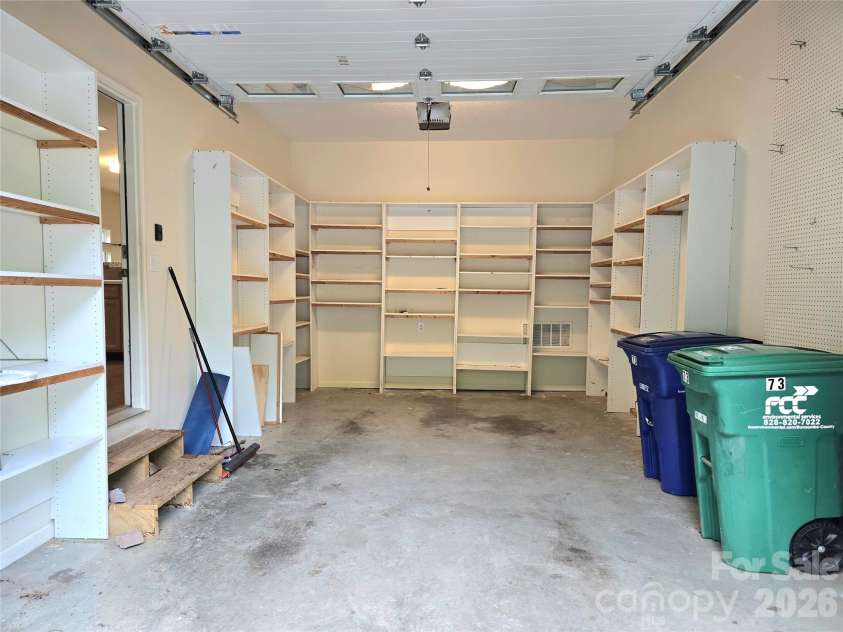 73 Dalya Road, Swannanoa, NC 28778.  MLS# CAR4352117, YatesRealty ID 21431. Garage with shelving