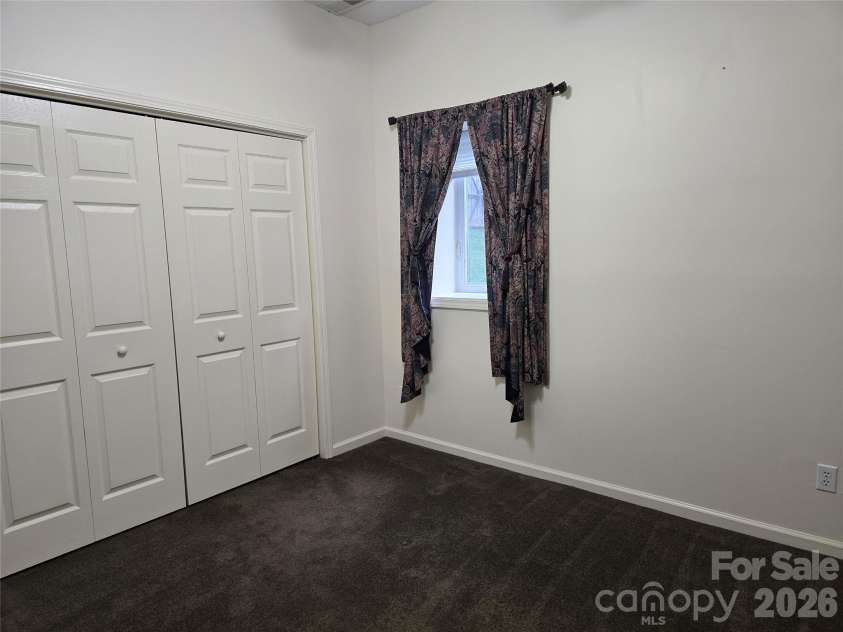 73 Dalya Road, Swannanoa, NC 28778.  MLS# CAR4352117, YatesRealty ID 21431. Lower level bedroom 