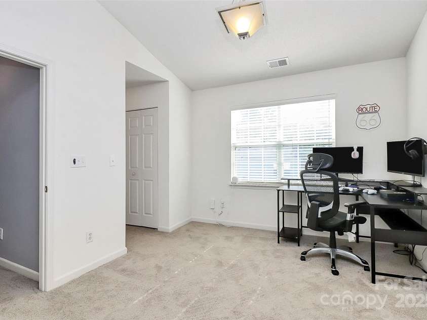 5980 Cougar Lane, Charlotte, NC 28269.  MLS# CAR4272520, YatesRealty ID 21432. Loft area that can be used as office, or additional bedroom.