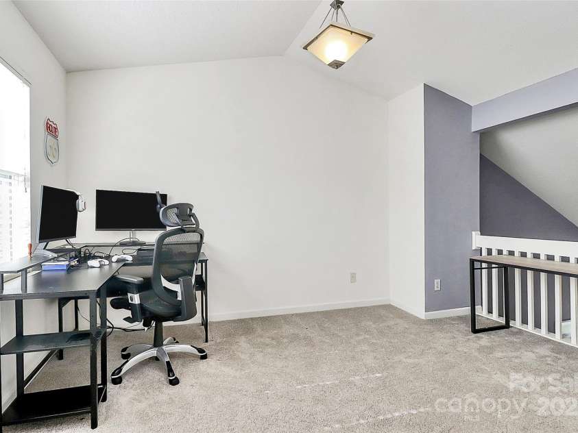 5980 Cougar Lane, Charlotte, NC 28269.  MLS# CAR4272520, YatesRealty ID 21432. Loft area with direct access to full bathroom.