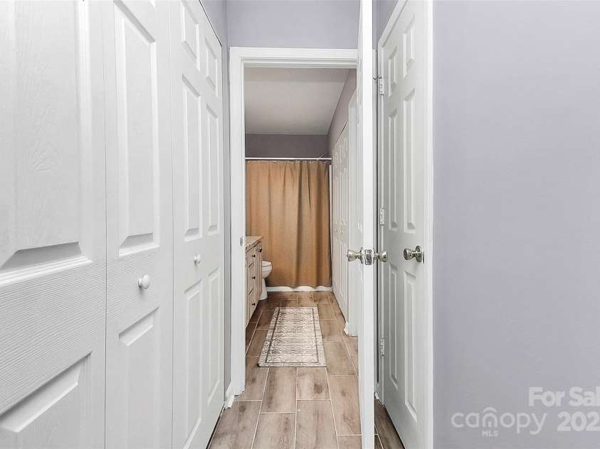 5980 Cougar Lane, Charlotte, NC 28269.  MLS# CAR4272520, YatesRealty ID 21432. View from bedroom 1 to bathroom