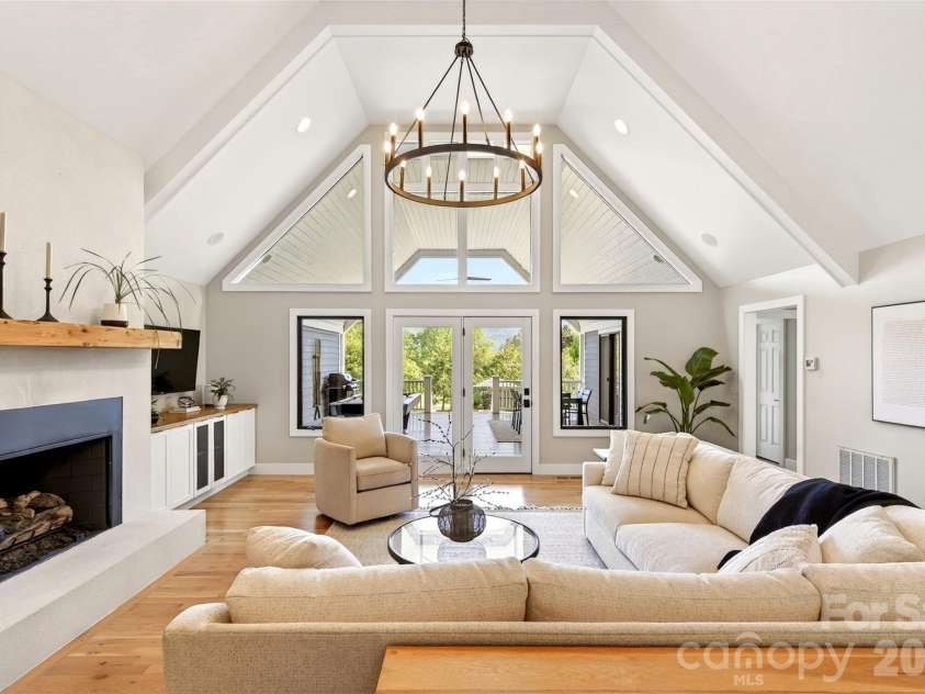 120 Old Lakey Gap Road, Black Mountain, NC 28711.  MLS# CAR4380220, YatesRealty ID 21433. Living room to covered deck