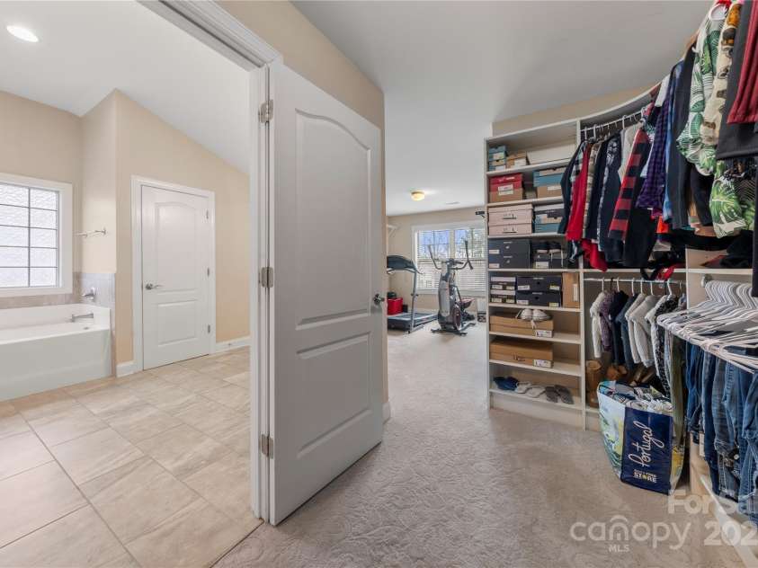 3019 Foggy Hollow Lane, Clover, SC 29710.  MLS# CAR4226789, YatesRealty ID 21435. Custom primary closet the size of a bedroom