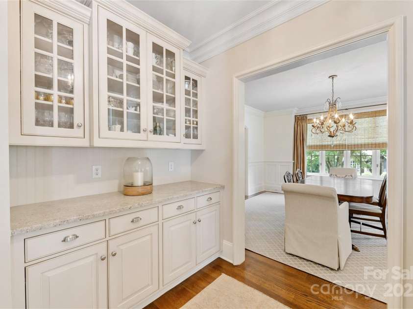 1728 Shadow Forest Drive, Matthews, NC 28105.  MLS# CAR4268214, YatesRealty ID 21441. A graciously-sized butler's pantry between the dining room & kitchen aides with entertaining.