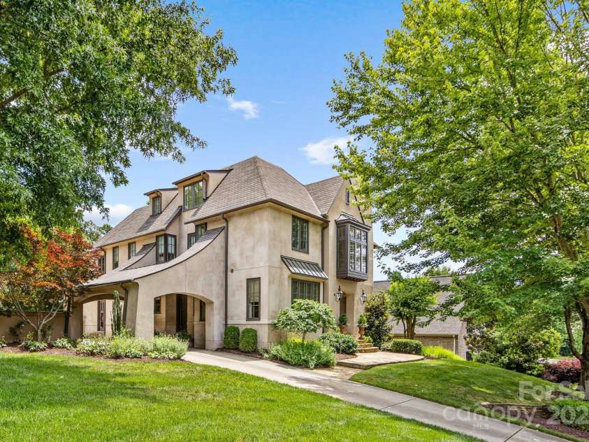 1728 Shadow Forest Drive, Matthews, NC 28105.  MLS# CAR4268214, YatesRealty ID 21441. A porte-cochere welcomes you home.