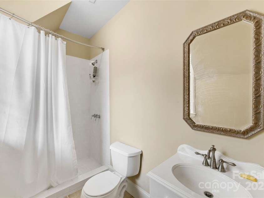 1728 Shadow Forest Drive, Matthews, NC 28105.  MLS# CAR4268214, YatesRealty ID 21441. The full bath above the garage.