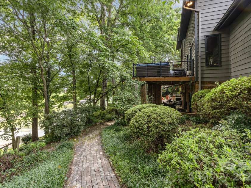 3004 Vernell Lane, Shelby, NC 28150.  MLS# CAR4238720, YatesRealty ID 21447. Brick path around side of house