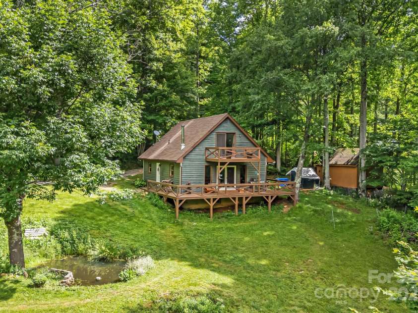 24 Cataloochee Lane, Waynesville, NC 28785.  MLS# CAR4268392, YatesRealty ID 21448. Cabin and workshop