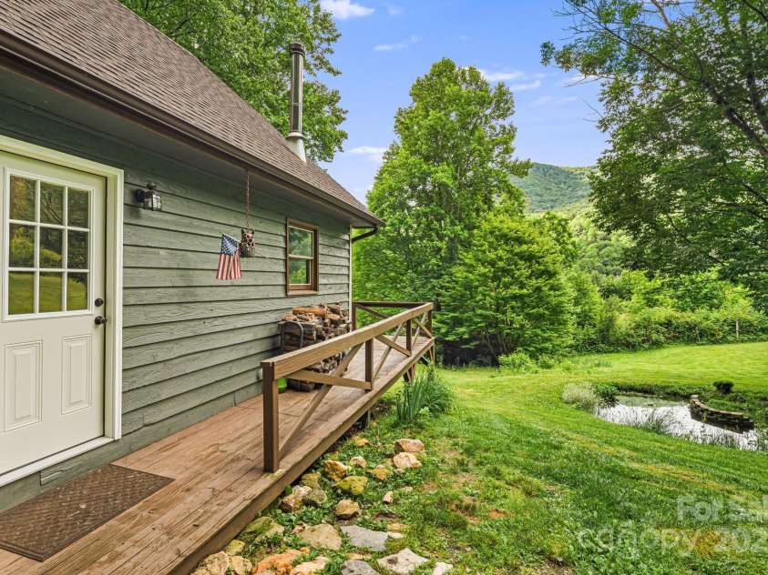 24 Cataloochee Lane, Waynesville, NC 28785.  MLS# CAR4268392, YatesRealty ID 21448. Pond view