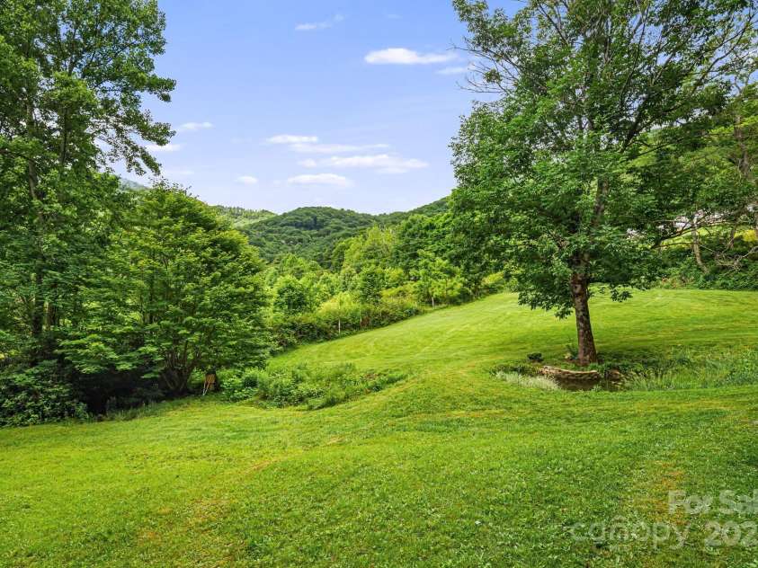 24 Cataloochee Lane, Waynesville, NC 28785.  MLS# CAR4268392, YatesRealty ID 21448. Rolling hills