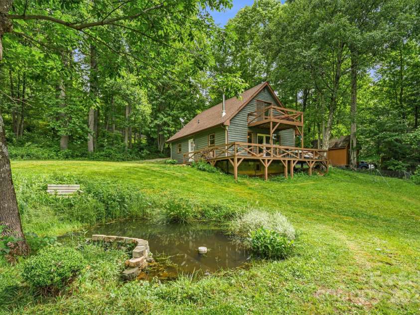 24 Cataloochee Lane, Waynesville, NC 28785.  MLS# CAR4268392, YatesRealty ID 21448. Spring-fed pond and mountain cabin