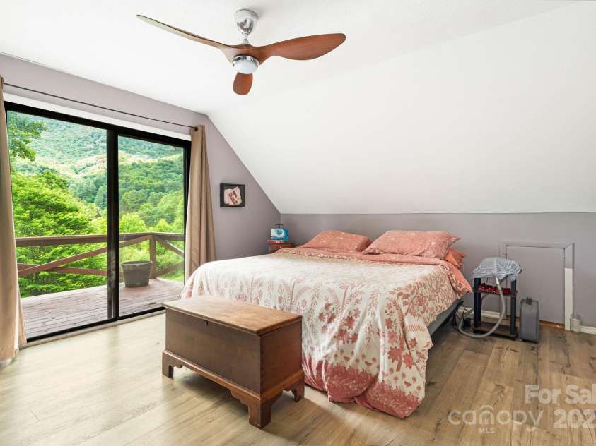 24 Cataloochee Lane, Waynesville, NC 28785.  MLS# CAR4268392, YatesRealty ID 21448. Third bedroom with balcony
