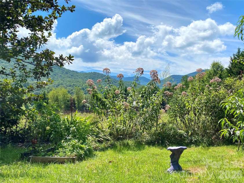 3 Taproot Trail, Barnardsville, NC 28709.  MLS# CAR4361662, YatesRealty ID 21454. Mountain views from the front yard