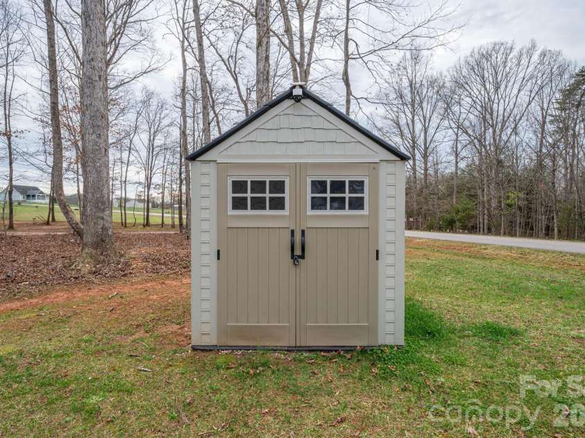 1310 Western Hills Lane, Vale, NC 28168.  MLS# CAR4356018, YatesRealty ID 21461. Well house with interior shelving for storage 