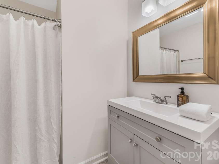 1801 Abbey Circle, Asheville, NC 28805.  MLS# CAR4347579, YatesRealty ID 21462. New vanities- Primary bath/shower