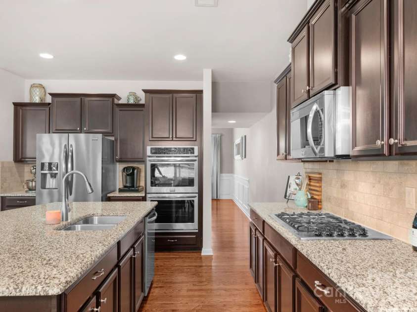 3701 Methodist Church Lane, Waxhaw, NC 28173.  MLS# CAR4270658, YatesRealty ID 21466. Gourmet kitchen with double ovens, gas cooktop and microwave