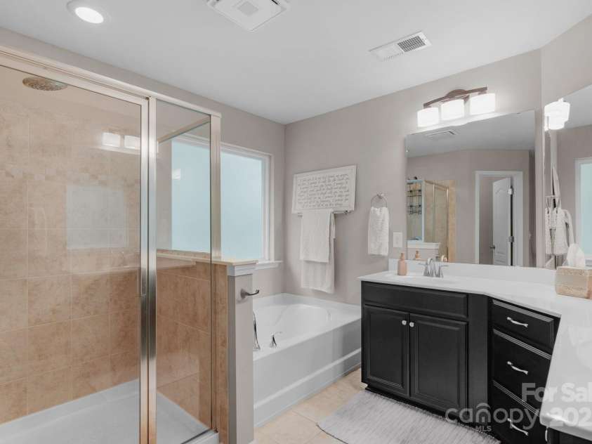 3701 Methodist Church Lane, Waxhaw, NC 28173.  MLS# CAR4270658, YatesRealty ID 21466. Primary bathroom with soaking tub and shower