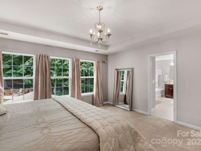 3701 Methodist Church Lane, Waxhaw, NC 28173.  MLS# CAR4270658, YatesRealty ID 21466. Primary bedroom with tray ceiling and en suite