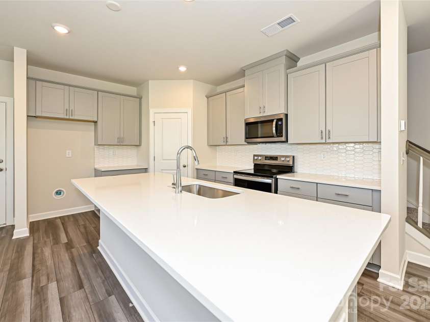 7028 Alva Terrace, Charlotte, NC 28216.  MLS# CAR4267597, YatesRealty ID 21471. Photo is not of the actual home, but is an inspirational photo of builder’s model home and may depict options, furnishings, and/or decorator features that are not included