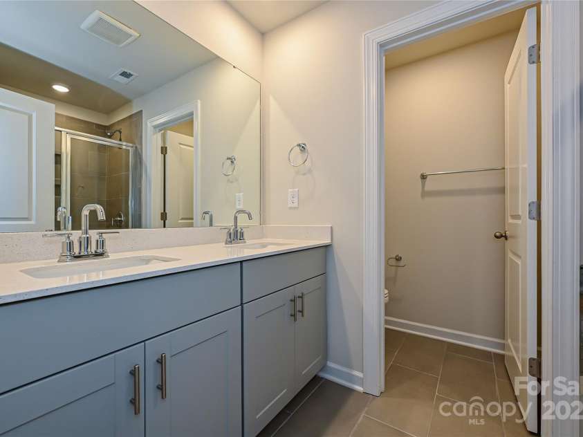 7028 Alva Terrace, Charlotte, NC 28216.  MLS# CAR4267597, YatesRealty ID 21471. Photo is not of the actual home, but is an inspirational photo of builder’s model home and may depict options, furnishings, and/or decorator features that are not included