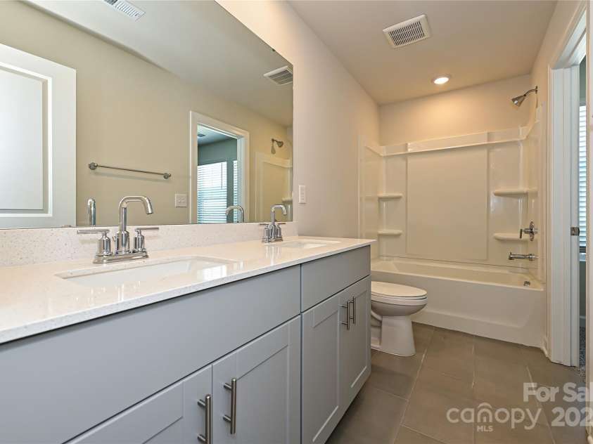 7028 Alva Terrace, Charlotte, NC 28216.  MLS# CAR4267597, YatesRealty ID 21471. Photo is not of the actual home, but is an inspirational photo of builder’s model home and may depict options, furnishings, and/or decorator features that are not included