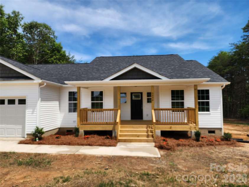 5405 Springs Road, Conover, NC 28613.  MLS# CAR4363103, YatesRealty ID 21472. Front Elev w/ Large Covered Porch and Decorative Landscaping