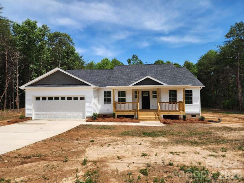 5405 Springs Road, Conover, NC 28613.  MLS# CAR4363103, YatesRealty ID 21472. Front Elev w/Large Covered Porch, 2 Car Garage and Decorative Landscaping
