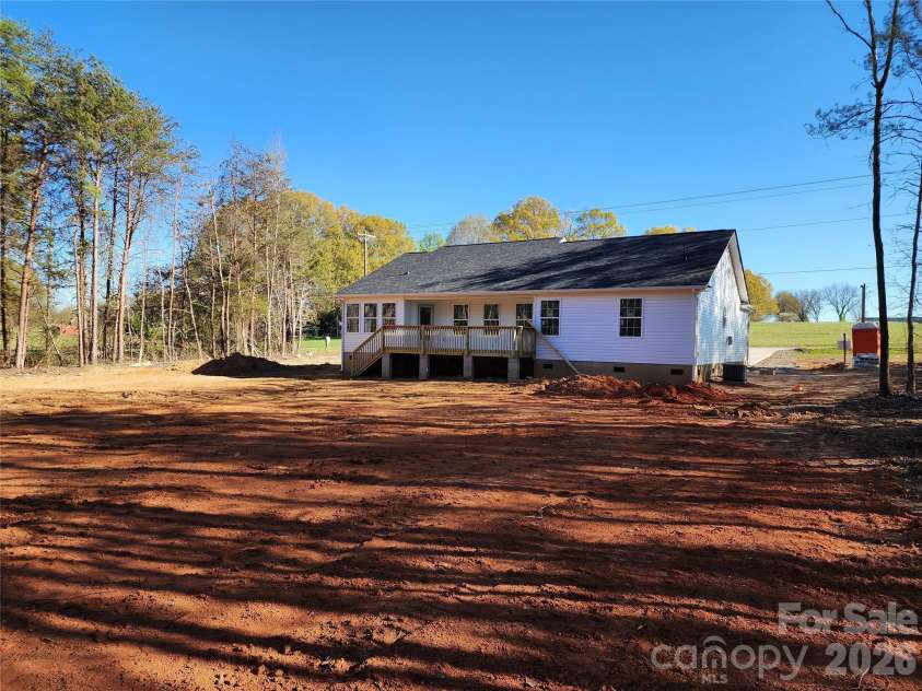 5405 Springs Road, Conover, NC 28613.  MLS# CAR4363103, YatesRealty ID 21472. Left Rear Elev w/Partial Covered Rear Deck and Large Rear Yard