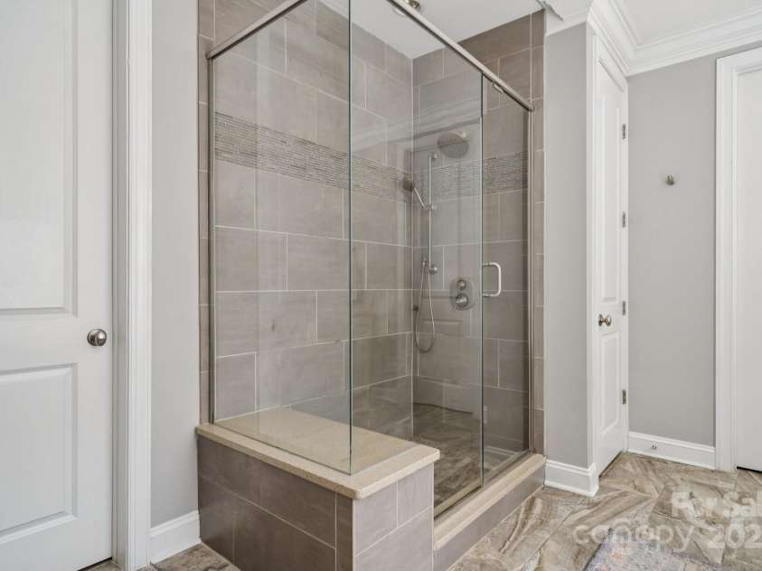 11412 Preservation Lane, Charlotte, NC 28278.  MLS# CAR4271558, YatesRealty ID 21473. Walk-in shower and dual closets in the primary bathroom.