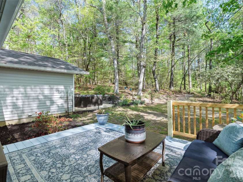 84 Chisholm Street, Saluda, NC 28773.  MLS# CAR4372070, YatesRealty ID 21473. Enjoy the back deck.