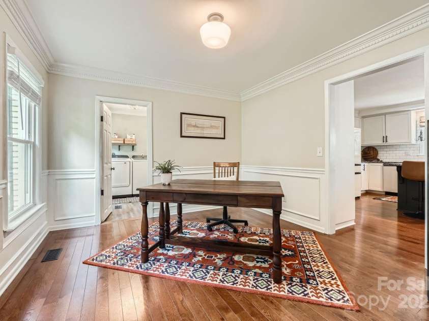 1175 18th Avenue, Hickory, NC 28601.  MLS# CAR4267840, YatesRealty ID 21483. This elegant dining room blends traditional charm with timeless craftsmanship. Detailed crown molding enhance the clean architectural lines, while the large window allows natural light to fill the space. Beautifully finishe