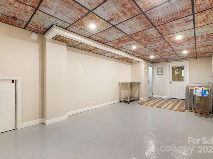 90 Reed Road, Asheville, NC 28805.  MLS# CAR4271385, YatesRealty ID 21485. Cool Metal Ceiling * Epoxy Floors