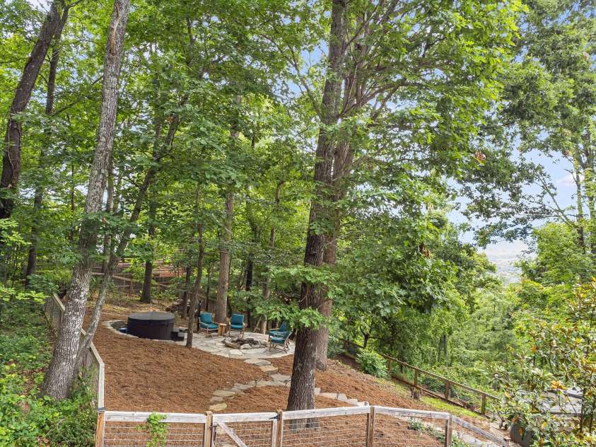 90 Reed Road, Asheville, NC 28805.  MLS# CAR4271385, YatesRealty ID 21485. Fenced-in with Hot Tub and Stone Firepit