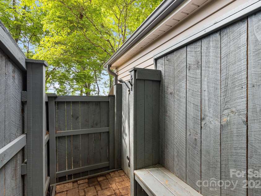 90 Reed Road, Asheville, NC 28805.  MLS# CAR4271385, YatesRealty ID 21485. Outdoor Shower with Changing Area